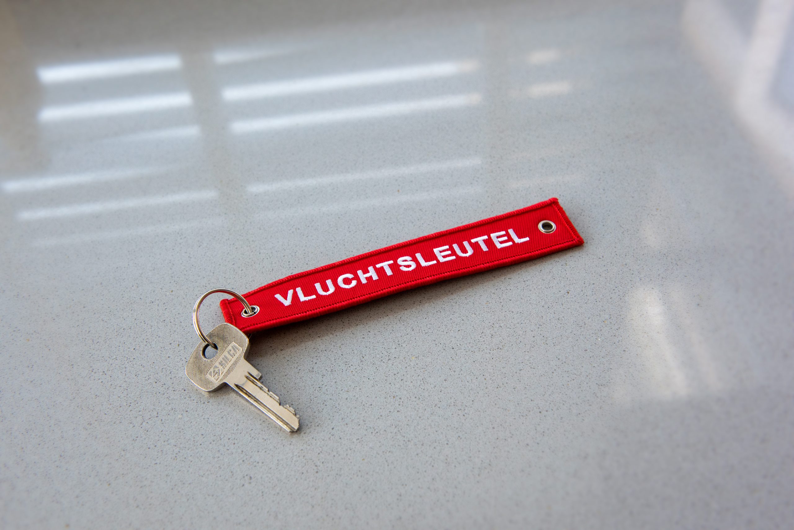 Huissleutel met label 'Vluchtsleutel'